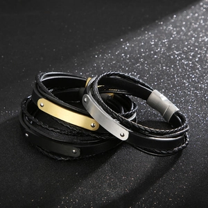 Bracciali multistrato in pelle intrecciata con fibbie in metallo spazzolato oro, argento e nero