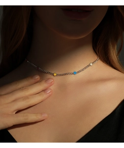 Close-up of s925 silver choker necklace featuring colorful heart-shaped pendants on a model
