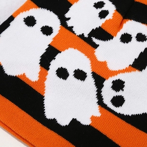 Close-up of Halloween knit hat featuring orange stripes and woven white ghosts