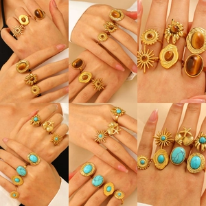 Bohemian gold ring set with turquoise and tiger eye stones in vintage irregular design