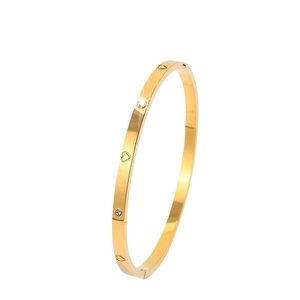 Polished 18k gold plated stainless steel bangle with heart engraving and zircon crystals