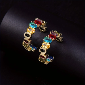 Elegant gold C-shaped hoop earrings with colorful rainbow oval gemstones for women