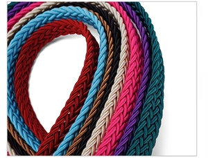 Close-up of vibrant woven belts in multiple colors showing detailed braided texture
