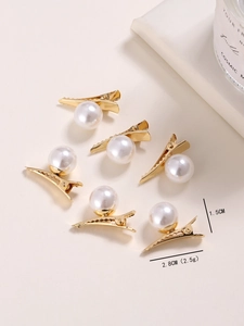 Detailed view of six gold duckbill hair clips with elegant faux pearls and dimensions
