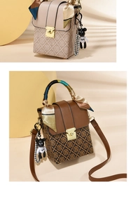 Detail of mini handbag with monogram pattern, silk scarf handle, and cute bear pendant