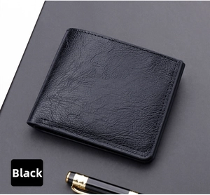 Detailed close-up of a black bifold leather wallet with lychee grain texture and a pen