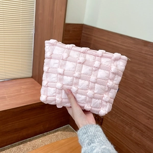 Close-up of pink bubble cloud canvas pouch showing textured square quilted pattern