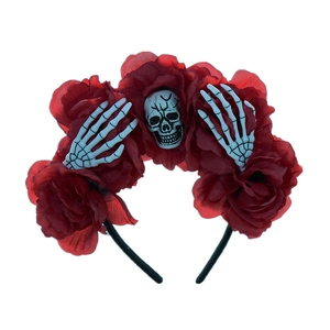 Close-up of Halloween headband with red roses and gray skulls on a black base
