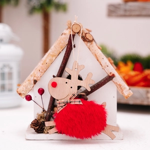 Detail of wooden reindeer ornament with red plush body for Christmas tree decoration