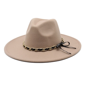 Detail of wool fedora hat with camel wide brim and black leather gold chain band
