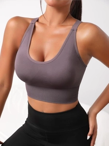 Close-up of seamless knitted yoga bra in smoky purple with ribbed wide hem and U-neckline