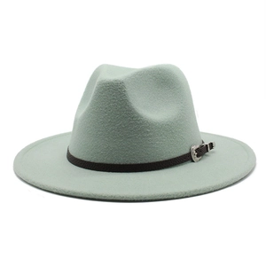 Detail of sage green wool fedora hat with dark brown leather band and silver buckle