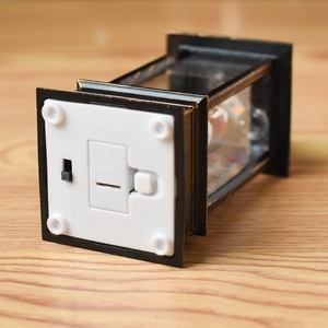 Detail view of the Christmas lantern base with power switch and 4.5V battery compartment