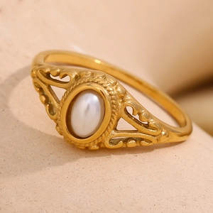 Gold plated stainless steel floral pearl ring with oval gemstone and filigree detail