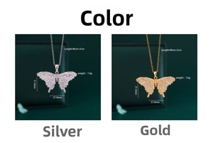 Detail view of 18K gold and silver butterfly pendants with dimensions and weight specs