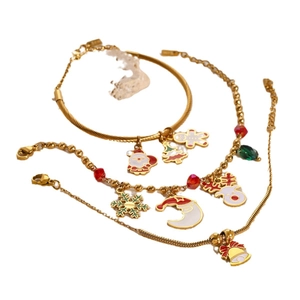 Golden stainless steel Christmas charm bracelet set with Santa and reindeer enamel pendants
