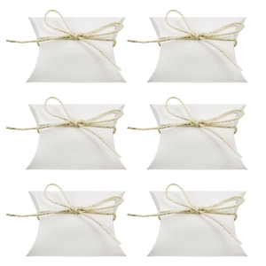 European style white kraft paper pillow candy boxes with jute twine bows on white background