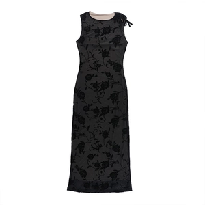 Close-up of black velvet flocked rose floral pattern on sheer mesh sleeveless dress