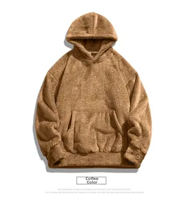 Detail of coffee brown fleece hoodie showing teddy fabric texture and kangaroo pocket