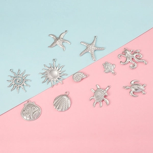 Silver ocean themed charms set featuring starfish, sea turtle and seashell for jewelry