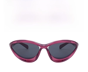 Close-up of sporty cat-eye sunglasses with transparent magenta frames and grey lenses