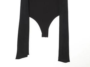 Detail of black bodysuit with bottom snap closure and delicate georgette fabric draping