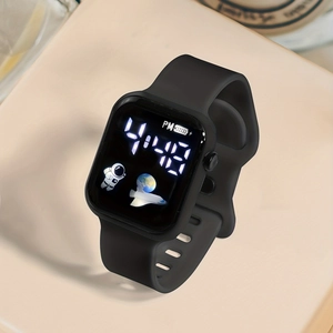 Close-up of black square LED digital watch with silicone strap and astronaut motif