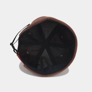 Brown corduroy docker hat for men and women featuring adjustable strap and black lining