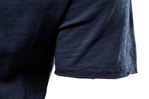Detail of double-needle stitching on short sleeve cuff made of slub cotton fabric