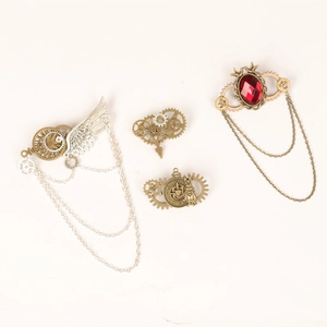 Set of four steampunk gear wings pins in bronze and silver tones with red resin gems