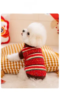 Detail of colorful striped dog sweater with red, brown, and green knit texture