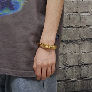 Men's antique silver dragon scale bracelet with vacuum plating finish on male model wrist