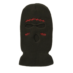 Detail of olive knitted balaclava mask with red "NOT NICE" embroidery and eye openings