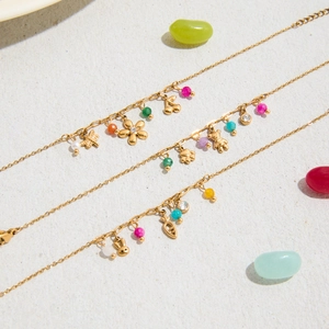 Gold plated stainless steel floral bracelet with colorful animal charms and beads