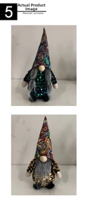 Detail view of two Halloween gnomes with sequin hats and spider charms for table decor