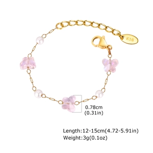 Detail of pink butterfly bracelet with gold chain, faux pearls and sizing measurements