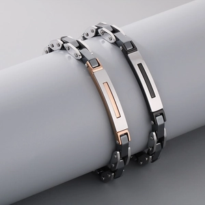 Detailed close-up of stainless steel watchband style bracelet with silver and rose gold link