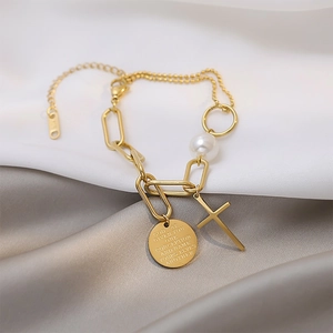 18k gold plated stainless steel bracelet with cross, pearl and engraved disc charms