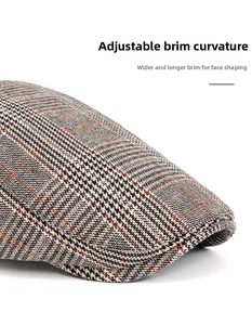Detail of classic plaid newsboy cap showing the bendable brim and wool blend texture