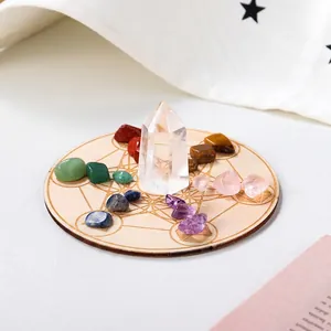 Natural crystal energy set with white quartz tower, assorted raw stones and wooden tray