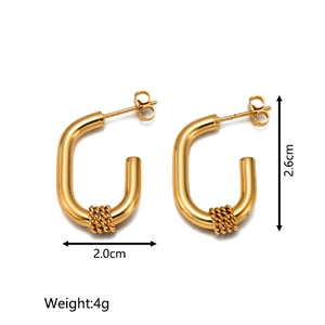Detail of gold U-shaped hoop earrings with spiral weave texture and size measurements