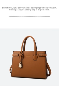Detail of tan pebble leather tote bag showing gold FASHION & BAGS logo and side metal buckles