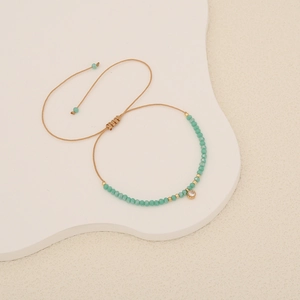 Bohemian braided rope bracelet with turquoise beads and a clear crystal pendant