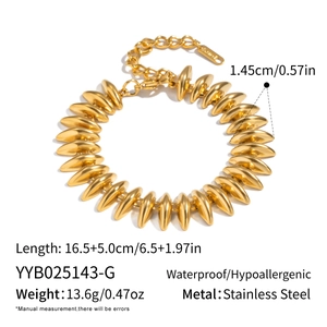Detail view of a gold bullet-shaped bead bracelet in stainless steel with sizing details