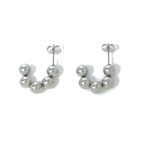 Detailed close-up of J-shaped silver bead earrings featuring high-polish stainless steel