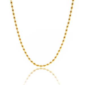 Detailed view of the layered gold beaded necklace on a white background with reflection
