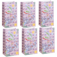 Detailed pattern of colorful mermaid scales and fish tail on vertical candy gift bags