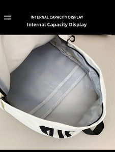 Detailed top view of the spacious white backpack interior with large storage capacity