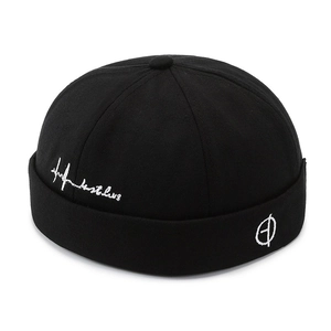 Classic black cotton brimless docker cap with white side embroidery in a streetwear style