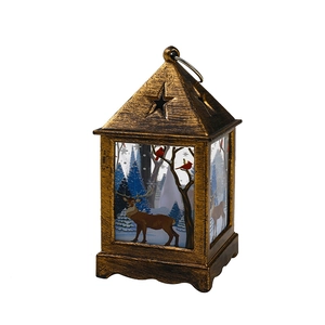 Vintage bronze Christmas lantern with star cutout and reindeer forest painted glass